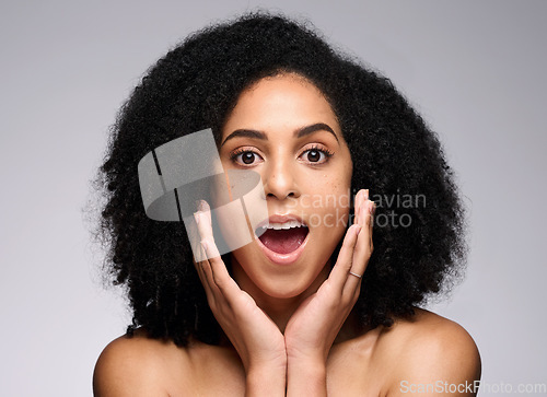 Image of Face skincare, wow and surprised black woman in studio isolated on gray background. Makeup cosmetics, portrait and female model shocked after spa facial treatment for healthy skin, beauty or wellness