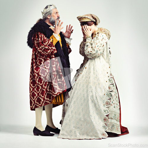 Image of King man, queen and argue in studio with anger, frustrated and crying in relationship, theater and drama. Medieval royal couple, fight and conflict conversation in renaissance, stress and woman cry