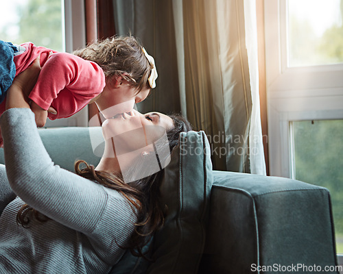 Image of Relax, happy and kiss with mother and baby on sofa for bonding, quality time and child development. Growth, support and trust with mom and daughter in family home for health, connection and care