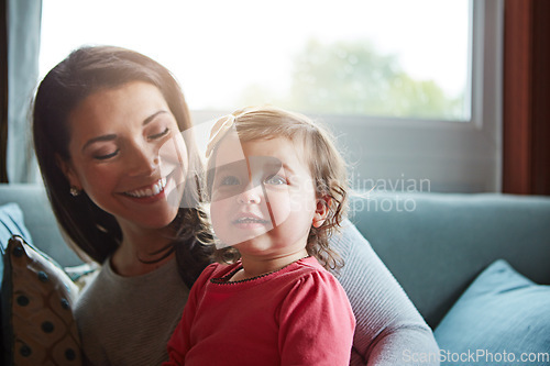 Image of Relax, happy and smile with mother and baby on sofa for bonding, quality time and child development. Growth, support and trust with mom and daughter in family home for health, connection and care