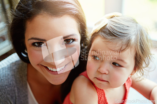 Image of Happy, playful and portrait of a mother with a baby for bonding, quality time and relaxation. Smile, happiness and face of a mom playing with a child for care, comfort and carefree parenthood