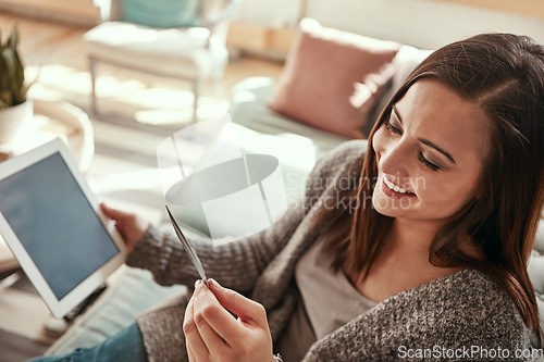 Image of Tablet, credit card and woman on sofa online shopping in home living room. Fintech, ecommerce and happy female with technology buying products, banking payment or paying for goods on virtual store.