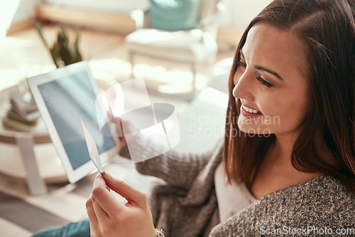 Image of Credit card, digital tablet and woman on a sofa for ecommerce sale, membership or subscription. Girl debit card and online shopping in a living room, happy and excited for purchase or online order