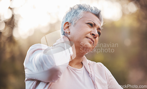 Image of Exercise, neck pain and senior woman outdoor, fitness and injury while training, wellness and health. Mature female, elderly lady and injured in nature, broken or massage joint for workout or healthy