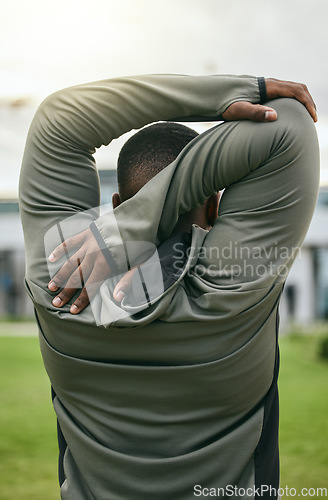 Image of Fitness, back and stretching with a sports black man outdoor for a warm up before exercise or workout. Park, training and goals with a male athlete getting ready to run on a field for cardio