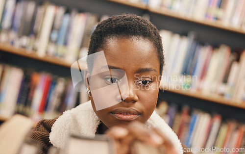 Image of Education, book search or black woman in library at college, university or school bookshelf for learning or studying. Research, scholarship or girl student focused on knowledge, goals or development