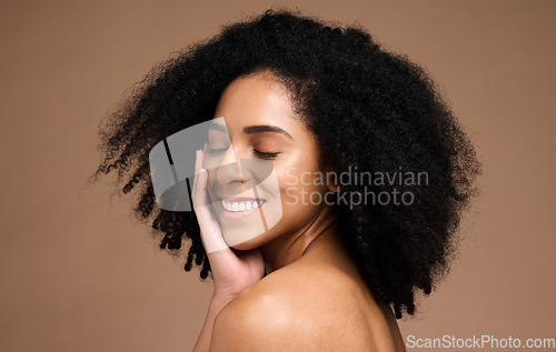 Image of Hair, afro beauty and happy black woman with natural cosmetics, facial makeup and luxury healthcare on studio background. Dermatology, spa salon and African model face with clean shampoo hair care