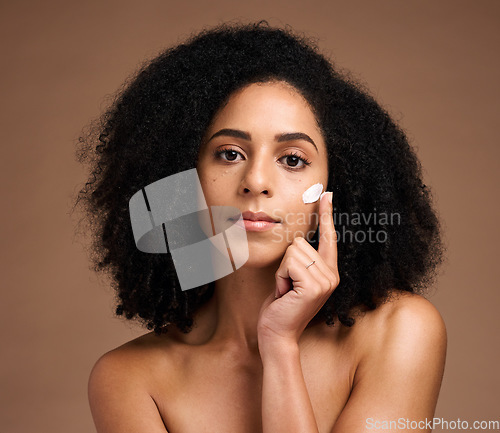 Image of Cream, beauty and african woman in portrait for face, skincare and cosmetics promotion of product in studio. Black woman model with skin care glow, dermatology facial or sunscreen hand application