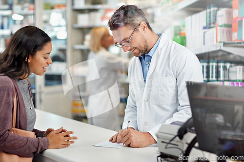 Image of Patient, doctor and writing prescription at pharmacy for customer medical or healthcare need. Pharmacist helping woman with diagnosis, invoice or receipt at drugstore counter or pharmaceutical clinic