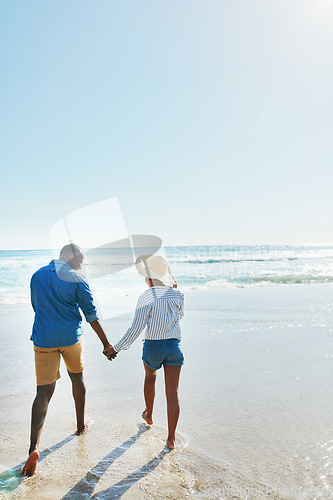 Image of Beach, walking and back of black couple holding hands, travel and enjoy outdoor quality time together. Ocean sea water, blue sky mock up or freedom peace for bonding people on Jamaica holiday mockup