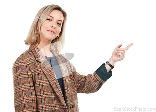 Image of Portrait, brand and smiling woman pointing finger isolated against a studio white background. Happy, fashion and confident young female showing empty mock up space or direction to a promo