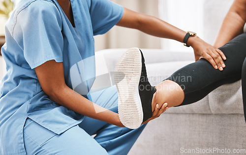 Image of Leg, physiotherapy and rehabilitation with a nurse and patient recovering from knee pain or injury. Disability, rehab and recovery with a healthcare professional examing the joint of a female at home