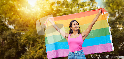 Image of Love, nature and woman with pride flag, smile happy non binary lifestyle of freedom, peace and equality in Brazil. Trees, sun and summer fun for happy woman in lgbt community with flag for gay pride.