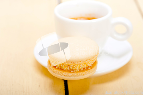 Image of colorful macaroons with espresso coffee