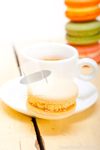 Image of colorful macaroons with espresso coffee