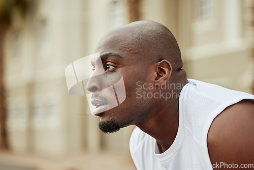 Image of Runner, fitness or tired black man running in cardio exercise, workout or sports training in city. Fatigue, face or focused healthy African athlete breathing or thinking of target, vision or goals