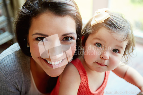 Image of Portrait, mother and girl with smile, happiness and bonding in living room, weekend and relax together. Motherhood, mama and daughter in lounge, cheerful and positive with care, loving and family