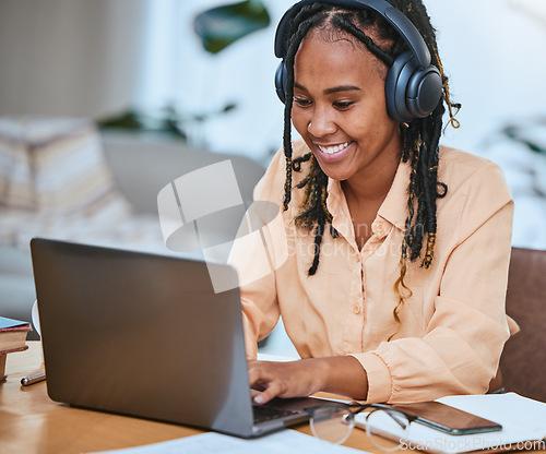 Image of Black woman, laptop and happy with music typing online, email communication or planning strategy in home office. African girl, corporate happiness and working on tech device for web design management