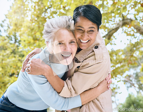 Image of Senior women, portrait and laughing hug in nature park, garden or relax environment in retirement, support or trust. Smile, happy friends and bonding elderly in embrace, comic activity or funny joke