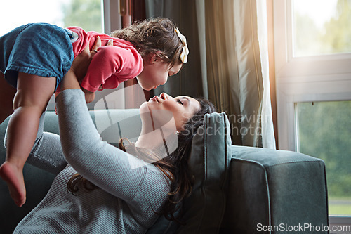 Image of Relax, happy and kiss with mother and baby on sofa for bonding, quality time and child development. Growth, support and trust with mom and daughter in family home for health, connection and care