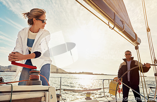 Image of Boat, couple and steering wheel for sea travel, retirement wealth and holiday investment hobby. Luxury sailing, rich and fun marriage people on ocean or lake water with outdoor sunglasses in sunshine