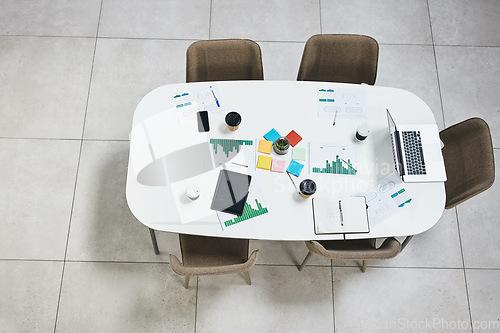 Image of Empty office, laptop or documents in digital agency space, advertising startup or creative small business. Furniture, top view or paper for research in office building with table, desk and chairs