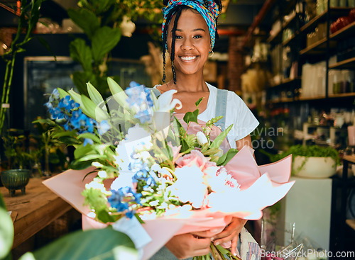 Image of Black woman, flowers and plant shop portrait for garden, floral or greenhouse retail. Happy entrepreneur working in plants startup business, store or market for sustainability, vision and gardening