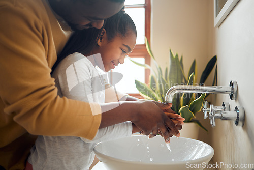 Image of Black family, father and child washing hands with clean water in home bathroom. Man teaching girl while cleaning body part for safety, healthcare and bacteria for learning about health and wellness