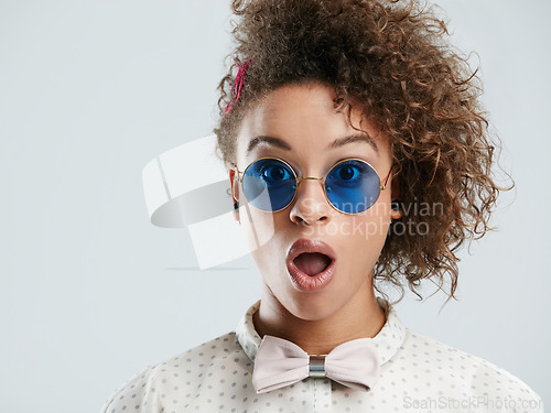 Image of Black woman, wow and surprise on her face with sunglasses isolated against a studio white background. Portrait of shock, wtf and open mouth by female excited for fashion sale, deal or discount