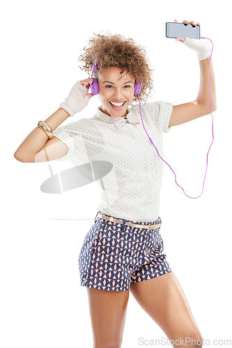 Image of Happy, dancing and woman portrait of a model with music, phone radio and web song. White background, black woman and happiness of isolated person streaming a podcast with headphones and mobile