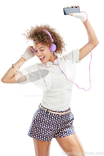Image of Happy, dance and headphones of a woman with music, phone radio and web audio dance. White background, black woman and happiness of isolated model streaming a podcast with headphones and mobile