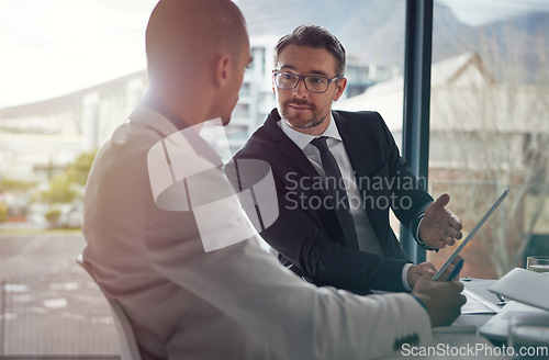 Image of Business team, tablet and meeting discussion for corporate strategy or partnership in office. Men talking about finance management for digital marketing investment with partner deal for growth