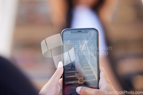 Image of Hands, phone and picture of woman with shopping bags shopping in the city. Discount deals, sales or pov of friend taking photo of female by stairs at mall with mobile smartphone for social media post