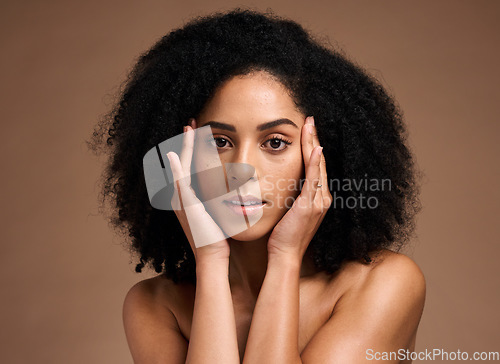 Image of Skincare, afro and hair portrait of black woman with healthy aesthetic and natural texture. African grooming cosmetics model girl face with beautiful skin glow in brown studio background.