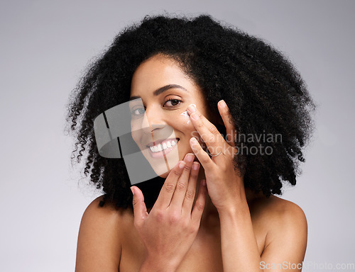 Image of Portrait, skincare and black woman with cream, face detox and wellness on grey studio background. African American female, girl and lotion for organic facial, cosmetics and natural care for beauty.