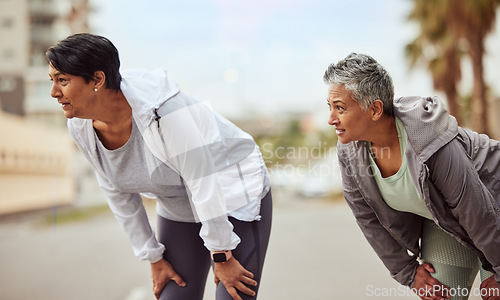 Image of Tired, running and friends with women in city training for stamina, endurance and fitness. Workout, goal and teamwork with senior runner jogging in town for support, exercise and cardio