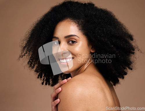 Image of Happy woman, afro hairstyle and face skincare on studio background in self love hug, healthcare wellness grooming or body dermatology. Portrait, smile or beauty model, natural curly style and makeup