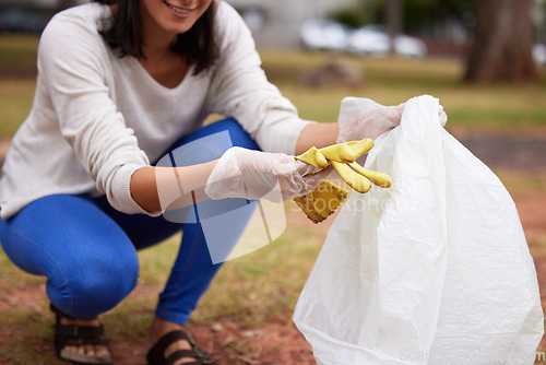 Image of Sustainability, pollution and woman cleaning a park for earth day, eco friendly and ecology in Costa Rica. Recycle, charity and volunteer picking up trash for service, clean energy and work in nature