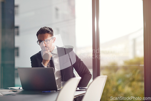 Image of Laptop, idea and boardroom with a businessman working on research for future company growth. Computer, thinking and innovation with a male employee or manager in his office with review his strategy