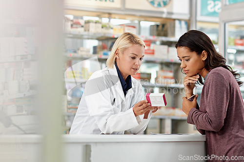 Image of Consulting customer and focus of store pharmacist at counter for expert help and customer service. Pharmaceutical advice and opinion of worker helping girl with medicine information at pharmacy.