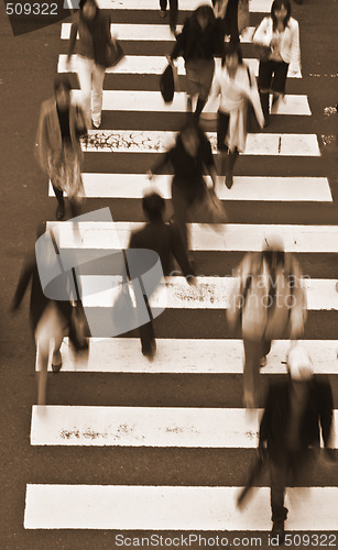 Image of People crossing the street-sepia tones