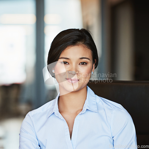 Image of Portrait, young and Asian business woman working in a modern office and smiling. Happy, confident and female entrepreneur or insurance professional in Bangkok on a webcam at a company