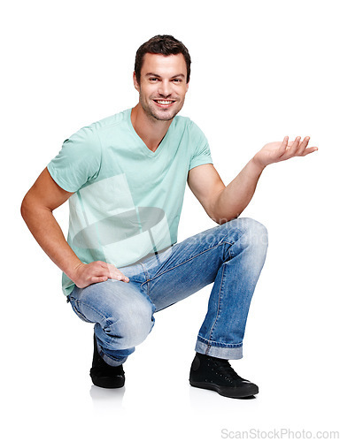 Image of Portrait, space and hand gesture with a man in studio isolated on a white background for marketing or advertising. Product, branding and mock up with a handsome young male posing to promote a brand