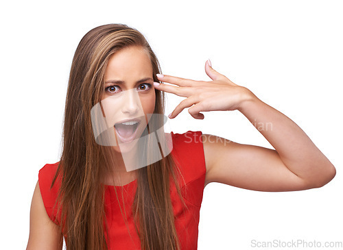 Image of Wow, hand and portrait of a woman with gun for shooting isolated on a white background in studio. Surprise, violence and girl with dark humor, finger rifle to shoot and pointing to head on a backdrop
