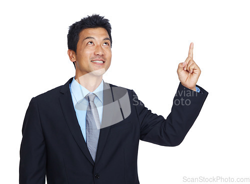 Image of Mockup, pointing and idea with a business asian man in studio isolated on a white background for growth. Marketing, thinking and point with a male employee showing empty mock up on blank space