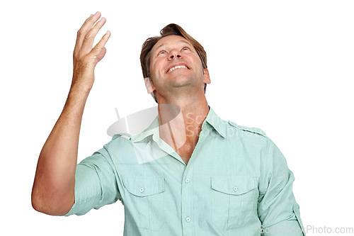 Image of Thank you, happy and man in studio, smile and celebrating victory while looking up on white background. Hand, success and young male in prayer for successful, winner or achievement while isolated