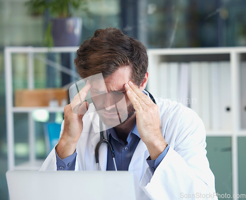 Image of Headache, burnout or doctor with stress in a hospital thinking of emergency, medical deadline or pressure. Migraine, man or healthcare worker frustrated with mental health problems or work anxiety
