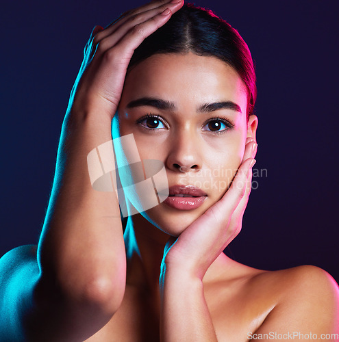 Image of Beauty, neon shadow light and portrait of woman with dark lighting, facial cosmetics and skincare glow. Luxury studio makeup, aesthetic creativity and face model with creative pink blue color design