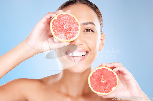 Image of Grapefruit, skincare and wellness of a woman with fruit, cosmetics smile or healthcare face glow. Model, happy or girl with fruits for health, cosmetic and healthy aesthetic facial beauty with food