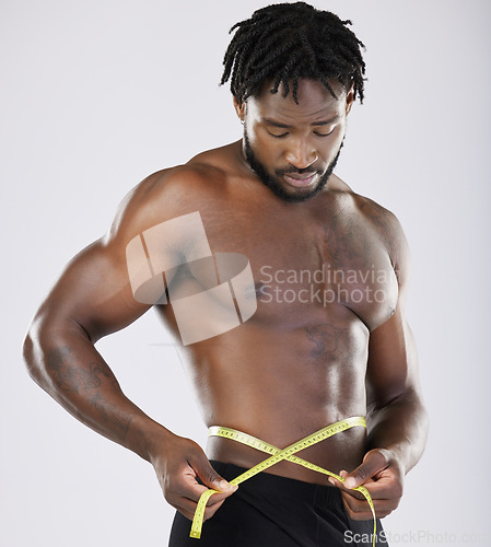 Image of Tape, fitness and man body isolated on white background for lose weight, bodybuilder diet and training wellness. Bodybuilding, studio and sports black person measure his waist, stomach or muscle